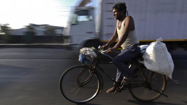 A migrant worker cycles home to Uttar Pradesh from Mumbai on May 9. Many workers do not possess documents needed to register for the trains; others simply do not want to wait any longer; and in still other cases, the trains themselves haven’t been approved by states that have to receive the migrant workers. (Satish Bate / HT Photo) A migrant worker cycles home to Uttar Pradesh from Mumbai on May 9. Many workers do not possess documents needed to register for the trains; others simply do not want to wait any longer; and in still other cases, the trains themselves haven’t been approved by states that have to receive the migrant workers. (Satish Bate / HT Photo)