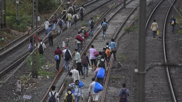 Migrant workers seen walking on a railway track at Kanjurmarg, due to police barricading on the roads.This group was attempting to walk all the way to their village in Uttar Pradesh. A day later, a tragic accident was reported in Aurangabad, where workers were run over by a train, while asleep on the tracks in the night. (Satish Bate / HT Photo) Migrant workers seen walking on a railway track at Kanjurmarg, due to police barricading on the roads.This group was attempting to walk all the way to their village in Uttar Pradesh. A day later, a tragic accident was reported in Aurangabad, where workers were run over by a train, while asleep on the tracks in the night. (Satish Bate / HT Photo)