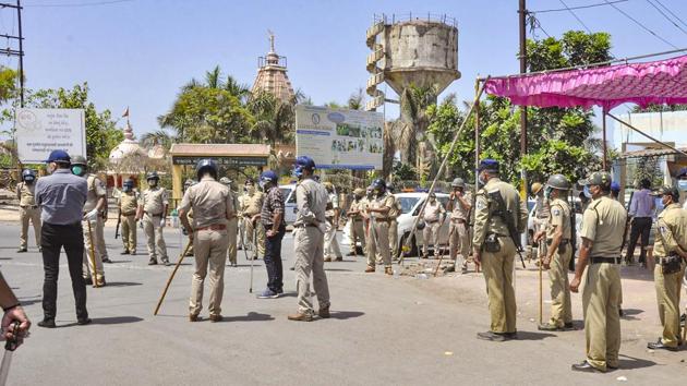 Heavy police deployment at Mora village in Surat after migrant workers clashed with police during a protest demanding the district administration to arrange for their travel back to their hometowns in UP, Bihar and Odisha during the ongoing nationwide Covid-19 lockdown.(PTI Photo)