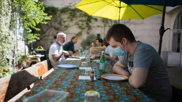 Pierre, a young autistic man hosted at the association Elan Retrouve, seen in a dining area with his educators. People with mental disorders are prone to high risks of depression and stress which can run elevated in such change. (Loic Venance / AFP)