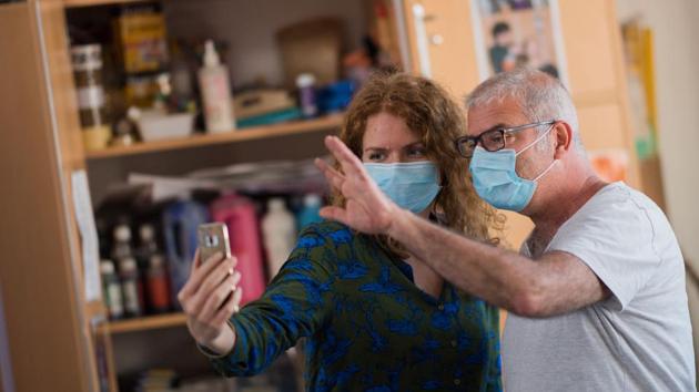 Educators make a video call with autistic young men who cannot be hosted at the association. Regular checks by health care professionals are key in helping people with mental disorders comprehend the pandemic and cope with it. (Loic Venance / AFP)