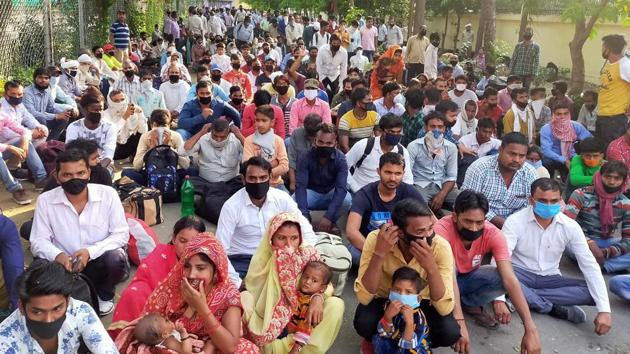 Migrants waiting for their for turn to get a medical screening before boarding trains back home from Ludhiana on Saturday. (Gurpreet Singh/HT)