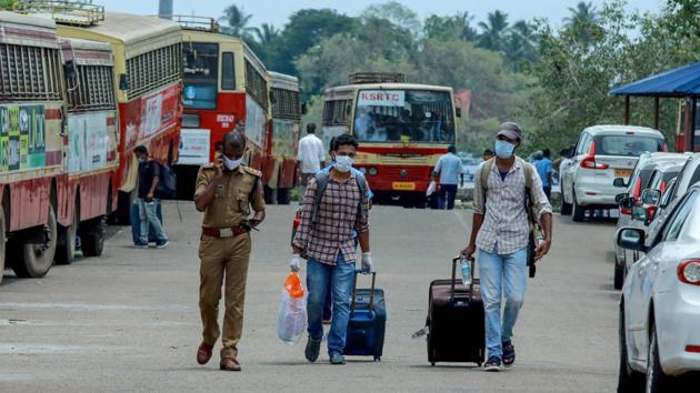 Indian citizens who arrived on board INS Jalashwa are shifted to a quarantine centre by bus. Arrangements for onward travel to hospitals or institutional quarantine centres and home quarantine have been ensured by the state government by deploying ambulances, state transport buses and taxis. (Arunchandra Bose / AFP) Indian citizens who arrived on board INS Jalashwa are shifted to a quarantine centre by bus. Arrangements for onward travel to hospitals or institutional quarantine centres and home quarantine have been ensured by the state government by deploying ambulances, state transport buses and taxis. (Arunchandra Bose / AFP)