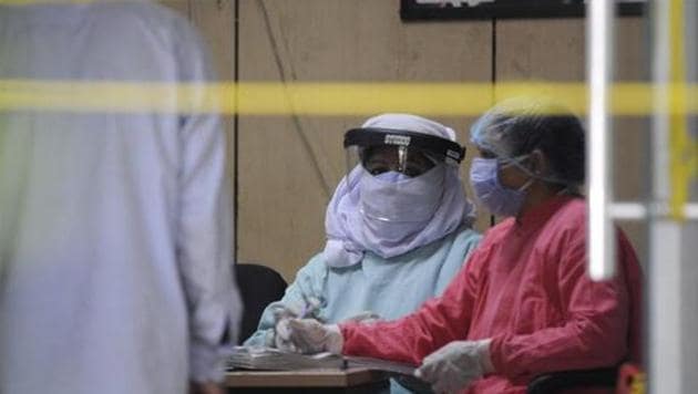 Medical professional seen inside district hospital in sector 30 during lockdown, in Noida, India, on Monday, April 27, 2020.(Sunil Ghosh / Hindustan Times)