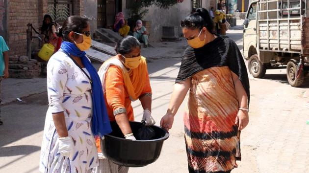 Anganwadi workers have been on the frontline in the battle against Covid-19, working tirelessly to sensitise people about the preventive measures, besides tracing NRIs and delivery food and ration and households having children below the age of six. (Representative image) (SANJEEV KUMAR/HT) Anganwadi workers have been on the frontline in the battle against Covid-19, working tirelessly to sensitise people about the preventive measures, besides tracing NRIs and delivery food and ration and households having children below the age of six. (Representative image) (SANJEEV KUMAR/HT)
