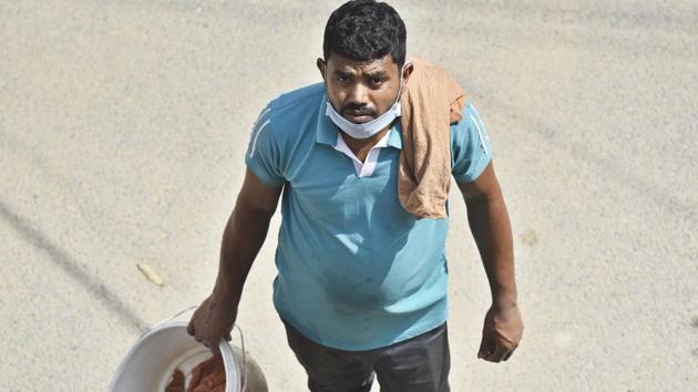Devashish Mandal, 35, resumed work as a car cleaner in Sector 47, Gurugram on May 4. He is a native of Samaspur village and said he’d earned 14,000 rupees in the last two months. (Sanjeev Verma / HT PHOTO) Devashish Mandal, 35, resumed work as a car cleaner in Sector 47, Gurugram on May 4. He is a native of Samaspur village and said he’d earned 14,000 rupees in the last two months. (Sanjeev Verma / HT PHOTO)