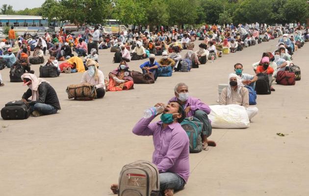 Migrant workers waiting for registration for special buses and trains for their native places, at the inter-state bus terminal in Sector 43, Chandigarh, on Monday. (Keshav Singh/ht) Migrant workers waiting for registration for special buses and trains for their native places, at the inter-state bus terminal in Sector 43, Chandigarh, on Monday. (Keshav Singh/ht)