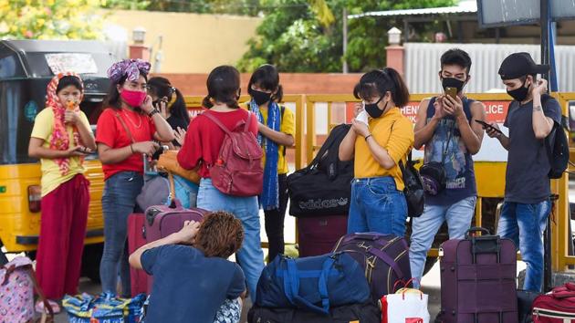 Migrant workers on way to board a special train for Manipur on Sunday. (PTI) Migrant workers on way to board a special train for Manipur on Sunday. (PTI)