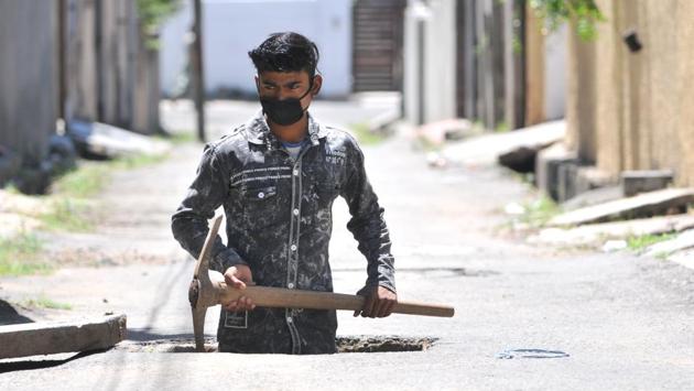Ritesh Kumar, 23, is a construction worker living in Jammu since 2018. He is originally from Bihar and has been living off his savings since the lockdown was imposed. He finally ventured out for work after May 4. (Nitin Kanotra / HT Photo ) Ritesh Kumar, 23, is a construction worker living in Jammu since 2018. He is originally from Bihar and has been living off his savings since the lockdown was imposed. He finally ventured out for work after May 4. (Nitin Kanotra / HT Photo )