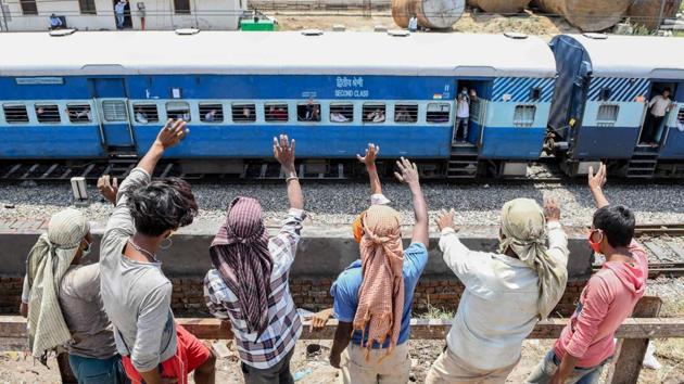 Migrant workers wave at their fellow workers and families on a special train bound to Barauni in Bihar as they head to their hometowns during lockdown to curb the spread of coronavirus (COVID-19) disease, in Amritsar. A sharp rise in Covid-19 cases in Bihar, Odisha, Rajasthan and Jharkhand since May 1, has been linked to migrant workers who have returned from various cities across the country, reported HT. (Narinder Nanu / AFP) Migrant workers wave at their fellow workers and families on a special train bound to Barauni in Bihar as they head to their hometowns during lockdown to curb the spread of coronavirus (COVID-19) disease, in Amritsar. A sharp rise in Covid-19 cases in Bihar, Odisha, Rajasthan and Jharkhand since May 1, has been linked to migrant workers who have returned from various cities across the country, reported HT. (Narinder Nanu / AFP)