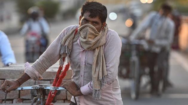 Mukesh, a construction worker, pulls a cycle cart laden with bricks along a flyover, in New Delhi, India, on Tuesday, May 5. From Bihar, he has been living on the construction site along with his family during the lockdown. (Sanchit Khanna / HT PHOTO) Mukesh, a construction worker, pulls a cycle cart laden with bricks along a flyover, in New Delhi, India, on Tuesday, May 5. From Bihar, he has been living on the construction site along with his family during the lockdown. (Sanchit Khanna / HT PHOTO)