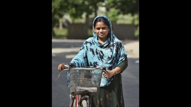 Mitthoo, 30, a domestic worker, poses for a photograph with her cycle in Sector 47, Gurugram on May 6. She has earned 10,000 rupees during the lockdown, which is half of what she usually earns in a month, she told HT. (Sanjeev Verma / HT PHOTO) Mitthoo, 30, a domestic worker, poses for a photograph with her cycle in Sector 47, Gurugram on May 6. She has earned 10,000 rupees during the lockdown, which is half of what she usually earns in a month, she told HT. (Sanjeev Verma / HT PHOTO)
