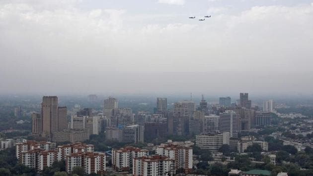 Indian Air Force (IAF) planes fly past New Delhi skyline as part of an activity being carried out by the IAF to show gratitude towards the frontline workers fighting the coronavirus disease (Covid-19) outbreak, in New Delhi, India. (REUTERS)