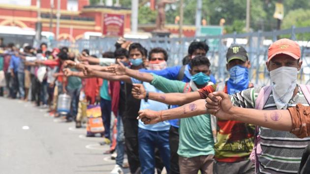 Migrant workers show their hands marked with quarantine stamps upon their arrival by a special train in Danapur station, Patna. As the workers started reaching their home states, they were placed in quarantine centres. (Santosh Kumar / HT Photo) Migrant workers show their hands marked with quarantine stamps upon their arrival by a special train in Danapur station, Patna. As the workers started reaching their home states, they were placed in quarantine centres. (Santosh Kumar / HT Photo)