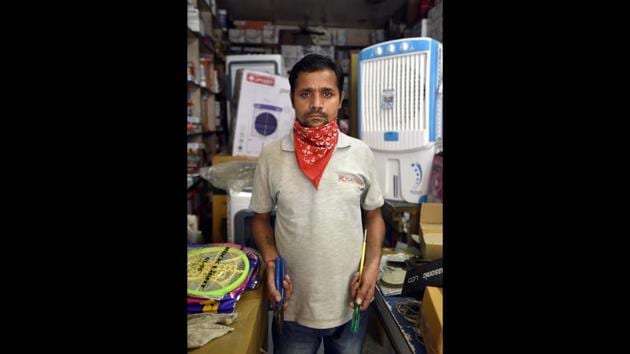 Sudhir Kumar, 36, an electrician, at his store in Krishna Nagar, New Delhi, India, on May 5. (Sonu Mehta / HT PHOTO) Sudhir Kumar, 36, an electrician, at his store in Krishna Nagar, New Delhi, India, on May 5. (Sonu Mehta / HT PHOTO)