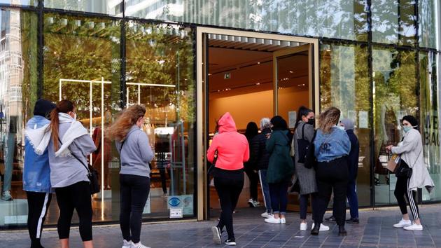 People queue to a store as Belgium began easing lockdown restrictions amid the coronavirus disease (COVID-19) outbreak, in Brussels, Belgium. (REUTERS) People queue to a store as Belgium began easing lockdown restrictions amid the coronavirus disease (COVID-19) outbreak, in Brussels, Belgium. (REUTERS)