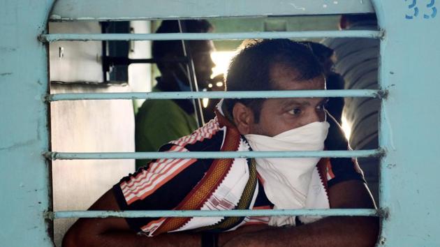 A migrant worker peeps out of the window as he boards a special train to go to native place in Bihar from Ajmer on Sunday.(ANI File Photo) A migrant worker peeps out of the window as he boards a special train to go to native place in Bihar from Ajmer on Sunday.(ANI File Photo)