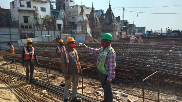 Thermal scanning of a worker being done at the construction site of Kashi Vishwanath corridor. (HT Photo) Thermal scanning of a worker being done at the construction site of Kashi Vishwanath corridor. (HT Photo)