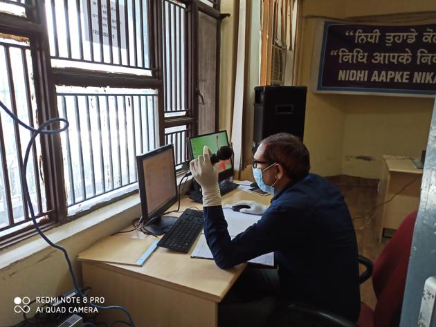 An official communicating with visitors with the help of a mic at the Employees’ Provident Fund Organisation office in Ludhiana on Tuesday. (HT PHOTO) An official communicating with visitors with the help of a mic at the Employees’ Provident Fund Organisation office in Ludhiana on Tuesday. (HT PHOTO)