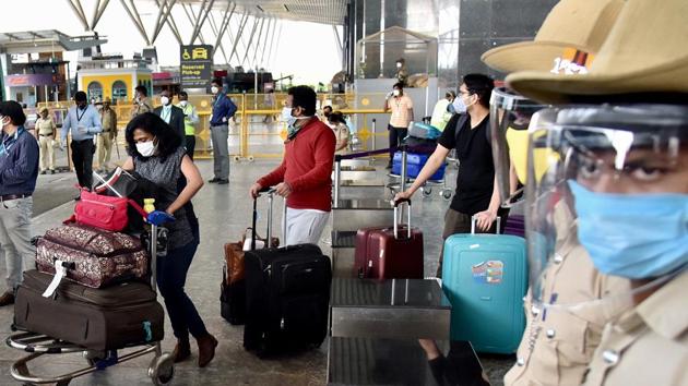 Indian nationals stranded in London amid the Covid-19 outbreak arrive at Kempe Gowda International Airport under mission Vande Bharat in Bengaluru on Monday.(ANI)