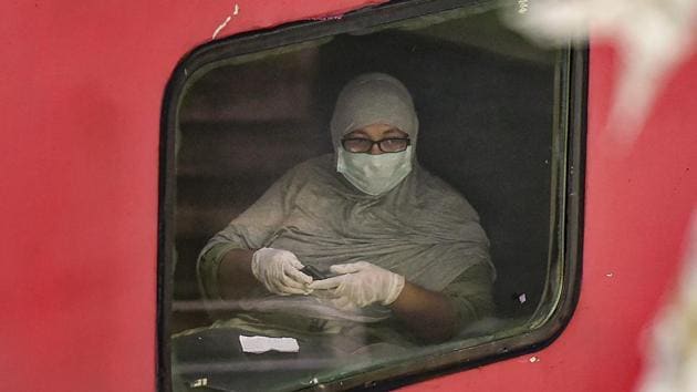 A woman seen inside an AC special train at Mumbai Central railway station. Upon their arrival to their destinations, passengers on these trains will have to abide by the quarantine stipulations prevailing in the states or union territories. (Kunal Patil / PTI) 