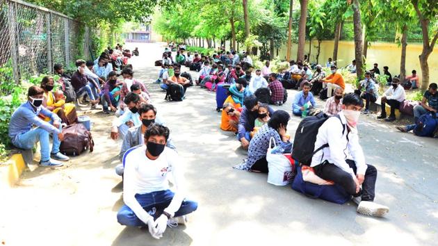 Migrants waiting for their turn for medical screening before the boarding trains back home in Ludhiana on Monday. (Gurpreet Singh/HT) Migrants waiting for their turn for medical screening before the boarding trains back home in Ludhiana on Monday. (Gurpreet Singh/HT)