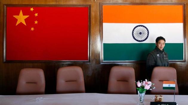 A man walks inside a conference room used for meetings between military commanders of China and India, at the Indian side of the Indo-China border at Bumla, in the northeastern Indian state of Arunachal Pradesh.(REUTERS) A man walks inside a conference room used for meetings between military commanders of China and India, at the Indian side of the Indo-China border at Bumla, in the northeastern Indian state of Arunachal Pradesh.(REUTERS)