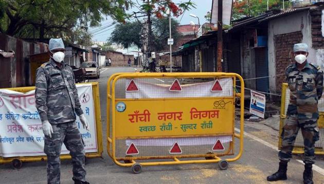 Security personnel stand guard at Hindpirhi locality, one of the coronavirus containment zone, during lockdown, in Ranchi, Jharkhand, India, on Wednesday, April 29, 2020. (Diwakar Prasad/ Hindustan Times) Security personnel stand guard at Hindpirhi locality, one of the coronavirus containment zone, during lockdown, in Ranchi, Jharkhand, India, on Wednesday, April 29, 2020. (Diwakar Prasad/ Hindustan Times)