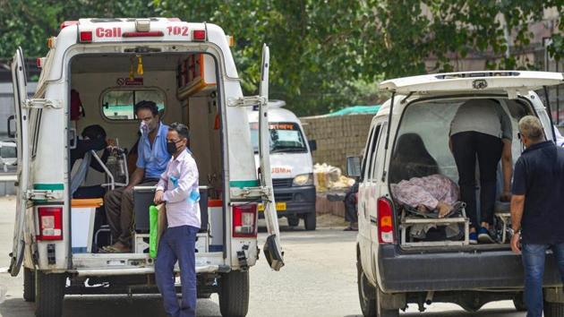 Suspected coronavirus positive patients being brought in ambulances at a government hospital, during the ongoing Covid-19 nationwide lockdown, in New Delhi. (Photo: PTI) Suspected coronavirus positive patients being brought in ambulances at a government hospital, during the ongoing Covid-19 nationwide lockdown, in New Delhi. (Photo: PTI)