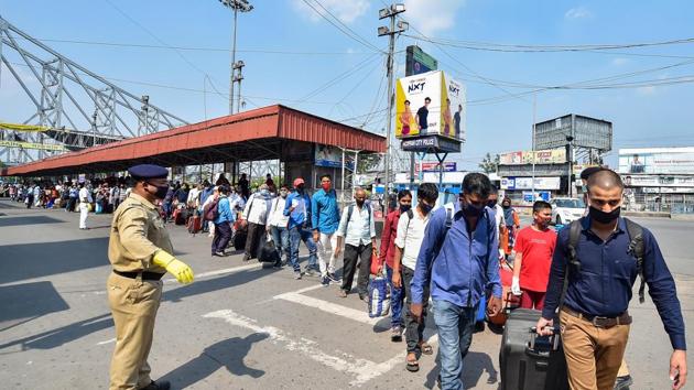Passengers stand in a queue as they arrive at Howrah Railway Station to board a train for Delhi during the nationwide COVID-19 lockdown, in Kolkata. (PTI) Passengers stand in a queue as they arrive at Howrah Railway Station to board a train for Delhi during the nationwide COVID-19 lockdown, in Kolkata. (PTI)
