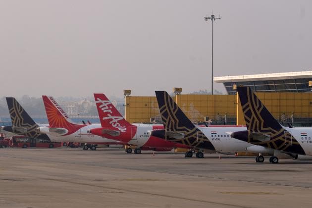 Grounded aircraft stand at Terminal 3 at the Indira Gandhi International Airport during a lockdown implemented due to the coronavirus in New Delhi, India.(Bloomberg)