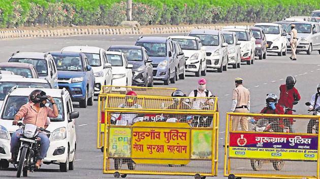 Haryana Police personnel screen commuters for identity cards and permits at the Delhi-Gurugram Border, near Ambience Mall, during lockdown in the wake of coronavirus, at Sirhaul toll plaza, in Gurugram, India, on Tuesday, 12 May 2020. (Yogendra Kumar/HT PHOTO) Haryana Police personnel screen commuters for identity cards and permits at the Delhi-Gurugram Border, near Ambience Mall, during lockdown in the wake of coronavirus, at Sirhaul toll plaza, in Gurugram, India, on Tuesday, 12 May 2020. (Yogendra Kumar/HT PHOTO)