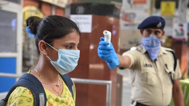 A passenger is thermal screened after Indian Railways resumed services partially, at Howrah Junction railway station in Kolkata, West Bengal. (Photo by Samir Jana / Hindustan Times) A passenger is thermal screened after Indian Railways resumed services partially, at Howrah Junction railway station in Kolkata, West Bengal. (Photo by Samir Jana / Hindustan Times)