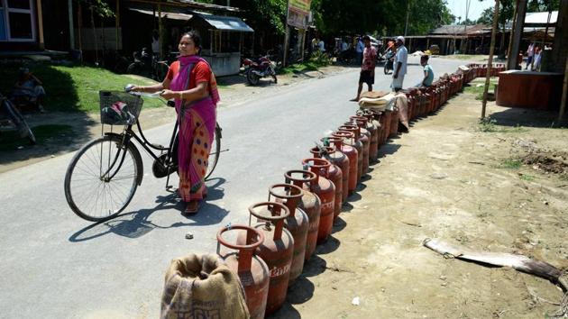 Residents queue up their LPG cylinders for refilling during the nationwide lockdown imposed in the wake of novel coronavirus pandemic at Kadamtala in Baksa district of Assam. (PTI) Residents queue up their LPG cylinders for refilling during the nationwide lockdown imposed in the wake of novel coronavirus pandemic at Kadamtala in Baksa district of Assam. (PTI)