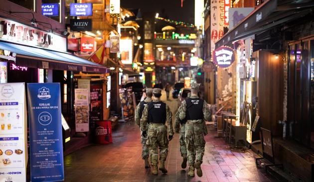 U.S Army military police patrol the street at night in the Itaewon area of Seoul, South Korea, on Saturday, May 9, 2020. (Bloomberg) U.S Army military police patrol the street at night in the Itaewon area of Seoul, South Korea, on Saturday, May 9, 2020. (Bloomberg)