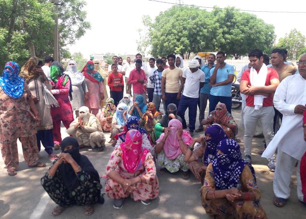 Residents staging a protest in Sundana village on Wednesday. They alleged that the district administration and state government had not taken any steps in relocating the liquor vend even after the panchayat passed a resolution in this regard. (Manoj Dhaka/HT) Residents staging a protest in Sundana village on Wednesday. They alleged that the district administration and state government had not taken any steps in relocating the liquor vend even after the panchayat passed a resolution in this regard. (Manoj Dhaka/HT)