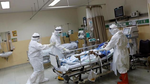 Health workers wearing protective suits prepare to transfer a patient to the surgical room from the Intensive Care Unit for the coronavirus disease patients at a hospital in Jakarta, Indonesia, on May 13. (Reuters Photo) Health workers wearing protective suits prepare to transfer a patient to the surgical room from the Intensive Care Unit for the coronavirus disease patients at a hospital in Jakarta, Indonesia, on May 13. (Reuters Photo)