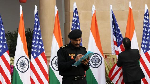 A member of the National Security Guard takes notes as India and US flags are placed at Hyderabad House in New Delhi, India. (Bloomberg) A member of the National Security Guard takes notes as India and US flags are placed at Hyderabad House in New Delhi, India. (Bloomberg)