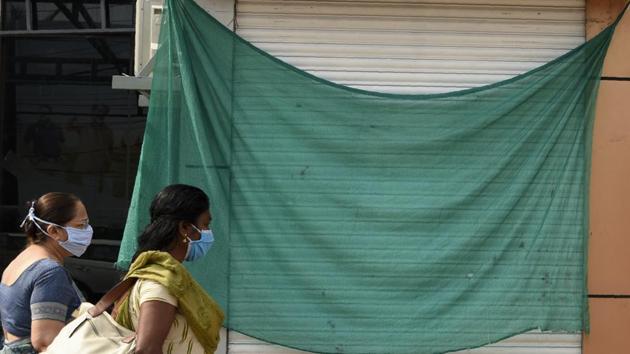 Indian women wearing masks arrive at an office building in Kochi, Kerala, India, Saturday, May 2, 2020.(AP)