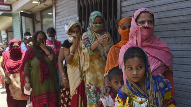 Residents of Pila bungalow in Dharavi, India’s largest slum cluster in Mumbai, queue at a food distribution at an Anganwadi on May 12. The case count for state capital Mumbai breached the 15,000 mark with 800 new incidences that pushed the city’s tally to 15,747 according to figures compiled by HT. (Satish Bate / HT Photo) Residents of Pila bungalow in Dharavi, India’s largest slum cluster in Mumbai, queue at a food distribution at an Anganwadi on May 12. The case count for state capital Mumbai breached the 15,000 mark with 800 new incidences that pushed the city’s tally to 15,747 according to figures compiled by HT. (Satish Bate / HT Photo)