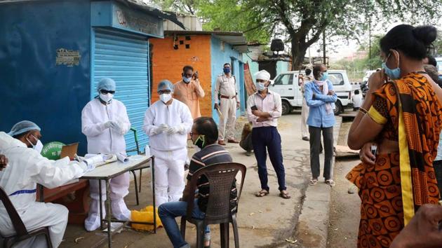A team of doctors wearing protective suits examine the residents of Vallabh Nagar locailty in wake of the coronavirus pandemic, during the nationwide lockdown, in Bhopal, Friday, May 1, 2020. (PTI/ representative) A team of doctors wearing protective suits examine the residents of Vallabh Nagar locailty in wake of the coronavirus pandemic, during the nationwide lockdown, in Bhopal, Friday, May 1, 2020. (PTI/ representative)