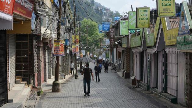 People walk along a street after the government eased a nationwide lockdown imposed as a preventive measure against the Covid-19, in Darjeeling on May 12. (AFP Photo) People walk along a street after the government eased a nationwide lockdown imposed as a preventive measure against the Covid-19, in Darjeeling on May 12. (AFP Photo)
