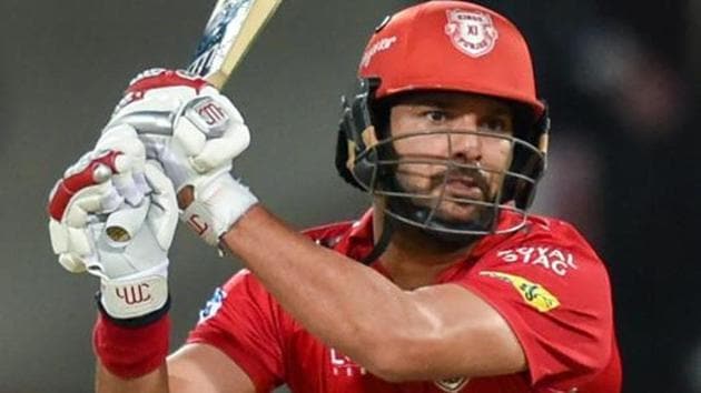 File photo of Kings XI Punjab player Yuvraj Singh plays a shot during an IPL cricket match against Mumbai Indians at Holkar Stadium in Indore on Friday.(PTI)