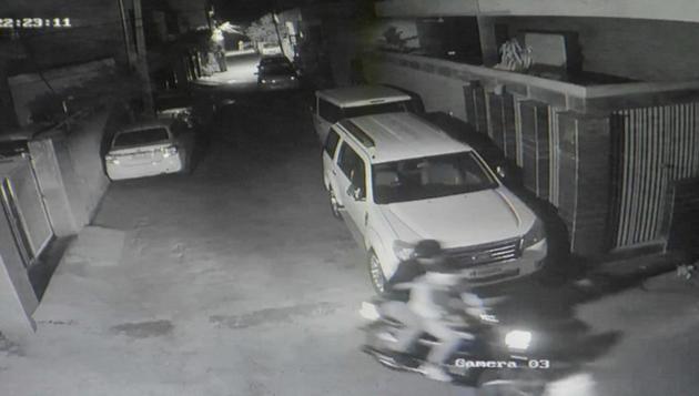 A grab of the closed-circuit television camera footage showing the assailants fleeing the spot after the attack in Janta Colony on Wednesday night.(HT PHOTO)
