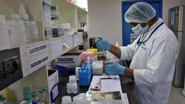A research scientist works on a testing kit for the coronavirus disease (COVID-19) inside a laboratory of GCC Biotech, during the outbreak of the disease, on the outskirts of Kolkata, India, May 8, 2020. (REUTERS)