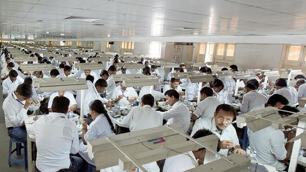 Workers polishing diamonds at Samarth Diamond's factory in Gujarat, India.(via REUTERS)