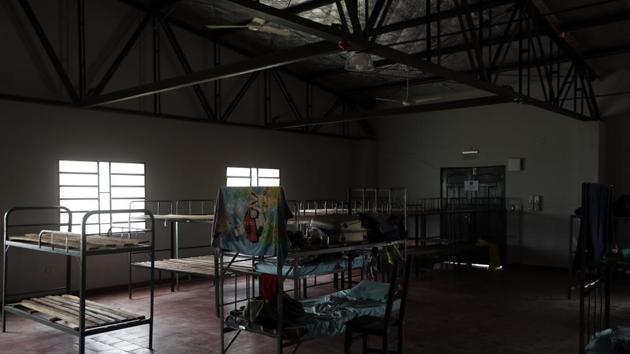 A towel hangs from a bunk in a military barrack, housing Paraguayan migrants returning from Brazil, in Remansito, Paraguay.(AP)