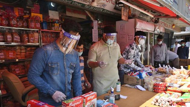 Shopkeepers and staff wearing face shields at a departmental store in Vasant Vihar market, New Delhi. (Ajay Aggarwal /HT PHOTO) Shopkeepers and staff wearing face shields at a departmental store in Vasant Vihar market, New Delhi. (Ajay Aggarwal /HT PHOTO)
