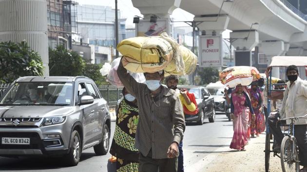 Migrants seen walking back to their homes in other states, at Laxmi Nagar Metro station in New Delhi, on Thursday, May 14, 2020. (Arvind Yadav/HT PHOTO) Migrants seen walking back to their homes in other states, at Laxmi Nagar Metro station in New Delhi, on Thursday, May 14, 2020. (Arvind Yadav/HT PHOTO)