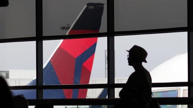 Passengers wait for a Delta Airlines flight in Terminal 5 at Los Angeles International Airport in this file photo. (AFP Photo) Passengers wait for a Delta Airlines flight in Terminal 5 at Los Angeles International Airport in this file photo. (AFP Photo)
